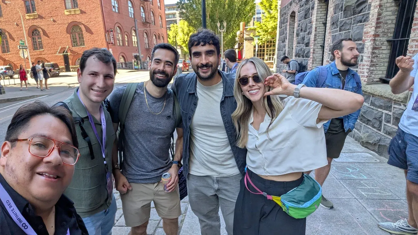 Rafael and four other attendees on a Portland street outside the Chain React venue